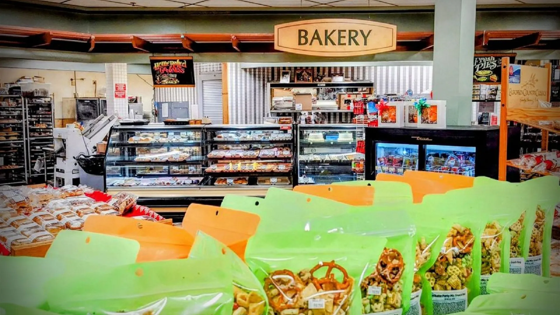 Bakery section with various pastries and snacks on display.